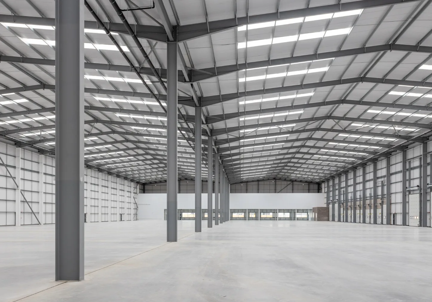 Interior of large empty warehouse building.